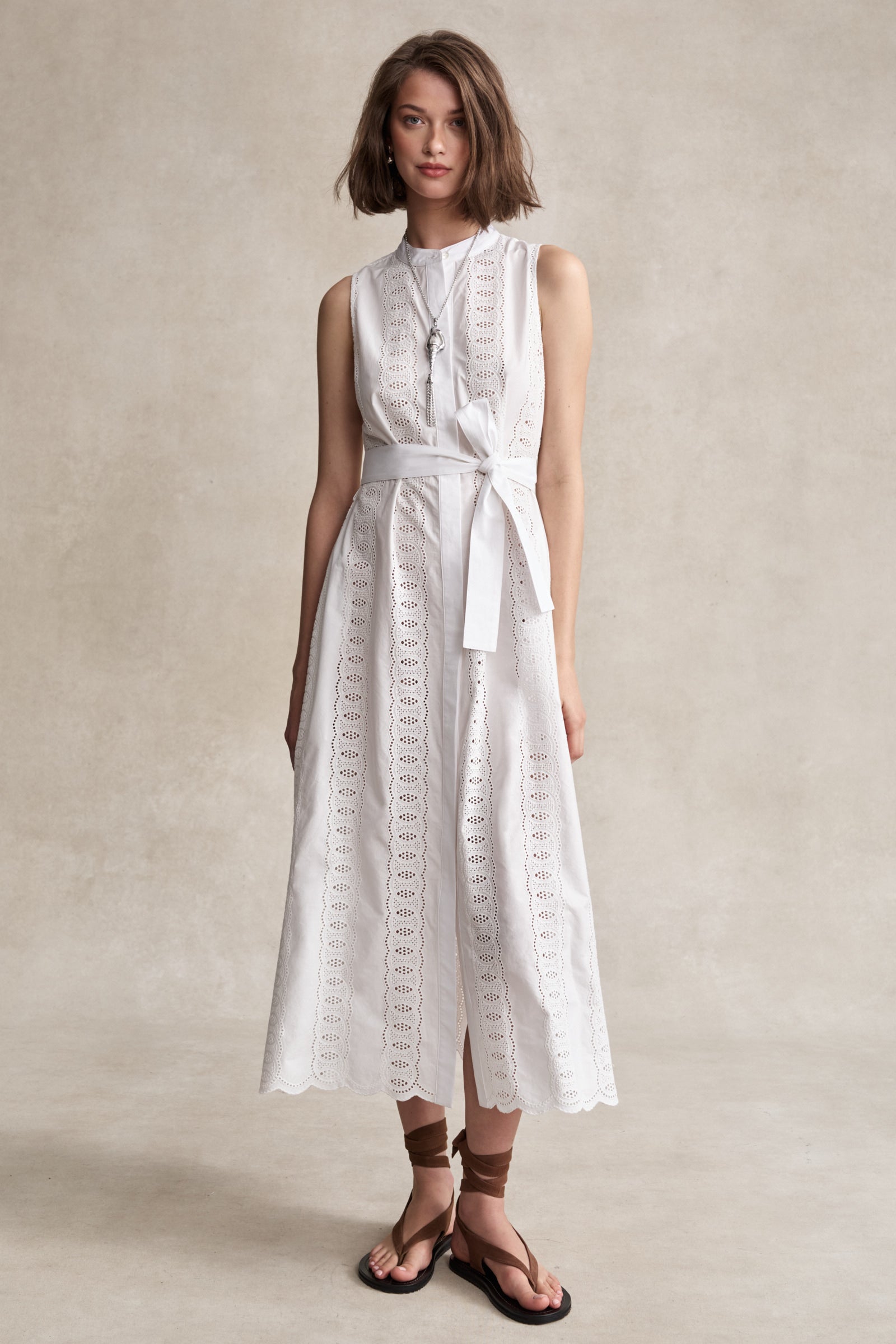 white eyelet midi dress Monica Mockneck tie waist belt Front button placket with signature bust flattering button placement and chest pocket Long sleeves with button cuffs Eyelet Cotton Primavera Eyelet Midi Dress |