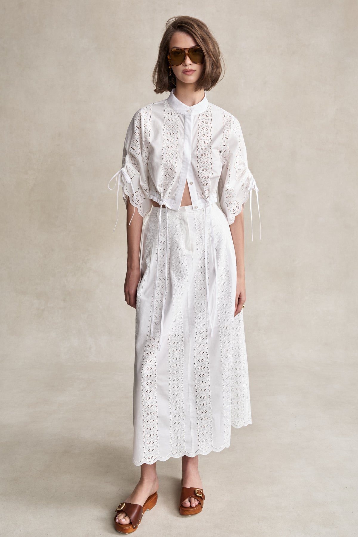 HEVRON Amaris Skirt White Eyelet Midi Skirt, studio shot